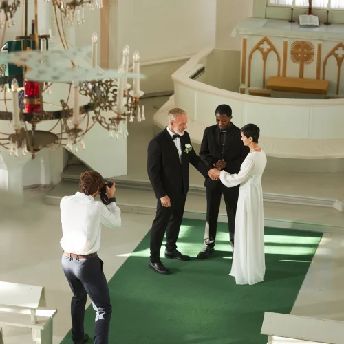 wedding-ceremony-in-church-with-photographer-takin-2025-03-05-12-52-55-utc.webp